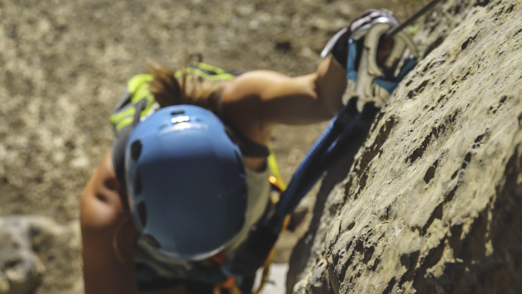Complete set of via ferrata equipment with helmet, harness and safety cords.