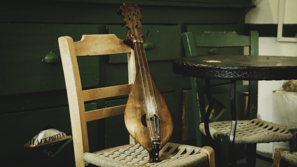 A local musician playing the Cretan lyre during a traditional festival.